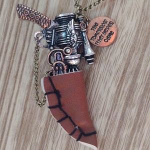 Gun in leather sling necklace